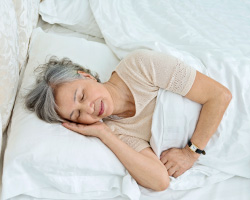 A woman asleep in bed.